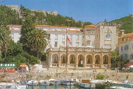  Hvar - City Hall, Hotel Palace and Fortica fort above on the hill 